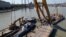 The Mermaid, which sank in the Danube in 2019, is lifted from the river as part of a salvage operation. (file photo)