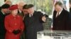 Moscow Mayor Yury Luzhkov (center) shows Queen Elizabeth II of the United Kingdom (front left) the model of a new British Embassy in Russia during her official visit in 1994.