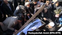 People attend the funeral of an Afghan female judge who was assassinated in Kabul on January 17.