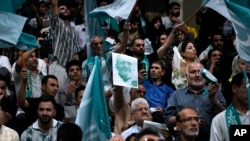 Pezeshkian's supporters attend his presidential campaign meeting in Tehran, June 2024