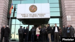 Armenia - People wait outside a district court building in Yerevan, 09Jan2012.