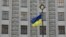 A Ukrainian national flag flies in front of the government building in central Kyiv. (file photo)