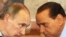 Italian Prime Minister Silvio Berlusconi (right) and his Russian counterpart, Vladimir Putin, confer during Putin's visit to Italy on April 26.