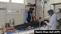 An Afghan man is treated at a hospital following an air strike in Kunduz on April 2. 