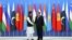 Tajik President Emomali Rahmon (right) shakes hands with Pakistani Prime Minister Imran Khan during the Shanghai Cooperation Organization (SCO) summit in Dushanbe on September 17.