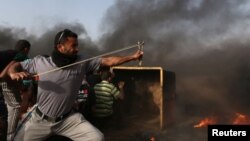 Прикордонні протести, як на цьому фото, стаються не рідше як раз на тиждень від весни 2018 року на кордоні Смуги Гази й Ізраїлю