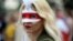A Belarusian opposition supporter wears a mask during a rally to protest the disputed results of the August 9 presidential election in Minsk on September 6.