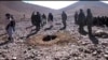 A video shows men stoning a woman in a hole to death in Afghanistan's Ghor province on October 25.
