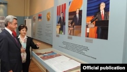 Armenia - President Serzh Sarkisian looks at a stand in the National Hisotry Museum in Yerevan displaying his and his predecessors' pictures, 13Sep2011.