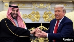 US President Donald Trump (left) meets Saudi Crown Prince Muhammad bin Salman at the White House in Washington on November 18. 
