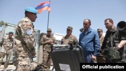 Afghanistan -- Armenia's Defense Minister Seyran Ohanian inspects Armenian troops near Kunduz, 24July 2010.
