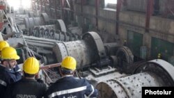 Armenia - Prime Minister Tigran Sarkisian (L) visits a metallurgical plant in Syunik province.