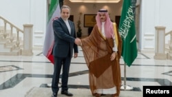 Iran's Foreign Minister Abbas Araqchi (left) meets with Saudi Arabian Foreign Minister Prince Faisal bin Farhan Al Saud in Jeddah on May 10.