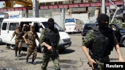 Özbek howpsuzlyk gullugynyň agzalary 