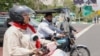 A man and a woman ride their motorcycles in central Tehran. (file photo)