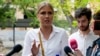 Lyubov Sobol speaks to the media as she arrives at a court in Moscow in August.