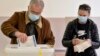A man casts his ballot at a polling station in Sarajevo on November 15.