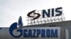 Signs at the Belgrade headquarters of Naftna Industrija Srbije AD (NIS), and the company's owner OAO Gazprom Neft.