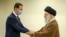 (FILES) This file handout picture provided by the office of Iran's Supreme Leader Ayatollah Ali Khamenei on May 08, 2022 shows him (R) greeting Syrian President Bashar al-Assad (L) in Tehran.