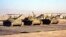 Three Taleban army tanks stand at Shindand airbase in Afghanistan's Farah province on October 1. The Taleban, the purist Afghan Islamic militia, have deployed the tanks to defend the air base from any attack from Iran.