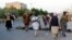 Private militiamen patrol the streets following fighting between Taliban and Afghan forces in Herat Province on August 6.