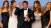 Sylvester Stallone and his wife Jennifer Flavin (2nd R) and their daughters, Sistine (L), Scarlet, (2nd L) and Sophia, pose with his award for Best Performance by an Actor in a Supporting Role in any Motion Picture for his role in "Creed" backstage at the