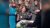 Mourners Honor Ukrainian Mother Killed While Protecting Her Child
GRAB