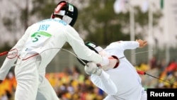 The Ukrainian team competing in the fencing event, part of the Modern Pentathlon, at the Rio Olympics in 2016.