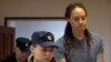 Brittney Griner is escorted after the final statements in a court hearing in Khimki outside Moscow in August.