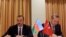 Azerbaijani President Ilham Aliyev (left) and Turkish Prime Minister Recep Tayyip Erdogan sign a protocol of the first meeting of Azerbaijan-Turkey High-Level Strategic Cooperation Council in Izmir on October 25.