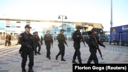 Albanian police patrol outside the Elbasan Arena during an October match with Serbia