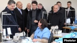 Armenia - Prime Minister Tigran Sarkisian (L) visits a textile factory in Amasia, Shirak province, 7Dec2011.