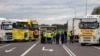 Transport company owners stand together as they block access to the Polish-Ukrainian border crossing in Dorohusk, Poland, on November 6 to protest against what they call unfair competition.