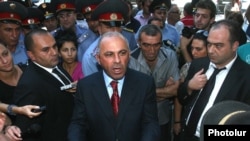 Armenia - Police chief Alik Sargsian talks to protesters outside the government building in Yerevan, 1Sept2011.