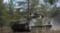 A British Warrior infantry fighting vehicle takes part in the Northern Forest exercises in Rovajarvi, Finland, on May 30.