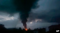 This grab taken from video distributed by Siranush Sargsyan's Twitter account on Monday, Sept. 25, 2023, shows smoke rising after a fuel depot explosion near Stepanakert, Nagorno-Karabakh.