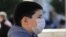 A child in Pristina wears a mask to protect against coronavirus.