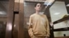 U.S. journalist Evan Gershkovich, arrested on espionage charges, stands inside a defendants' cage before a previous hearing to consider an appeal at the Moscow City Court on September 19, 2023.