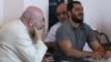 Armenia - Father Anton Totonjian (L) and Artur Vartanian (R) stand trial on coup charges in Yerevan, 28Jul2017.