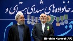Хасан Роухани (слева) и Мохаммад Джавад Зариф