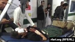 Wounded arrive at a hospital in Balkh.