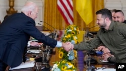 U.S. President Joe Biden shakes hands with Ukrainian President Volodymyr Zelenskiy in the East Room of the White House on September 21.