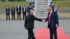 US President Donald Trump (R) greets Russian President Vladimir Putin on the tarmac after they arrived at Joint Base Elmendorf-Richardson in Anchorage, Alaska, on August 15, 2025.