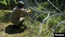 Lithuania has hardened its border with Belarus and authorized border guards to push back illegal migrants. 