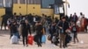 گروهی از مهاجران افغان پس از اخراج از ایران در نقطه صفر مرزی، اسفند ۱۴۰۳