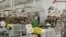 Armenia -- Workers at a car battery plant in Yerevan.