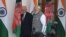 Indian Prime Minister Narendra Modi (right) and Afghan President Mohammad Ashraf Ghani walk together before a meeting in New Delhi on October 24.