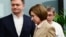 Moldovan President Maia Sandu (center) leaves a press conference at her campaign headquarters in Chisinau on October 21.