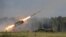 Russia -- A Russian TOS-1A multiple rocket launcher fires during the opening of the Army-2015 international military forum in Kubinka, outside Moscow, June 16, 2015