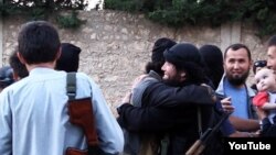 Сирияга согушка барган казакстандыктар. (Youtube сайтынан алынган бул сүрөт качан тартылганы белгисиз).